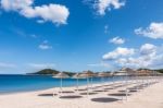 Parasols At Liscia Ruja Beach In Sardinia Stock Photo