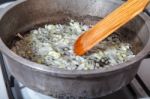 Woman Frying Onions Stock Photo