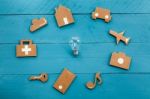 Cardboard Web Icons  And Light Bulb On Blue Background Stock Photo