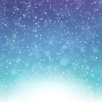 Falling Snow On The Blue And Purple Background Stock Photo