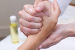 Woman Enjoying Hand Massage At Beauty Spa Stock Photo