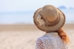 Woman Looking Into The Sea Stock Photo