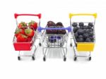 Fresh Summer Fruits, Cherry, Strawberry, And Blueberry In Shoppi Stock Photo