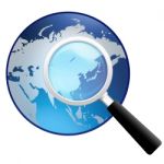 Magnifying Glass With Earth Globe Stock Photo