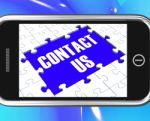 Contact Us On Smartphone Showing Online Assistance Stock Photo