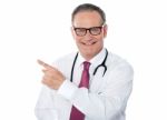 Medical Professional Pointing Back Stock Photo