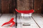 Red Hot Chili Peppers With Glass Of Water Stock Photo