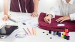 Two Young Women Working As Fashion Designers And Drawing Sketche Stock Photo