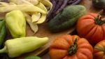 Several Vegetables On Wooden Chopping Board And Table Stock Photo