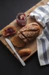 Dark Multigrain Bread Whole Grain And Jam Fresh Baked On Rustic Closeup Stock Photo