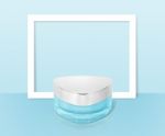 Blue Triangle Cosmetic Jar On Paper Frame Background Stock Photo