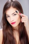 Woman Combing Eyebrow Stock Photo