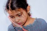 Little Girl With Toothache In White Background Stock Photo