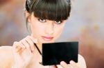 Woman Applying Make Up Stock Photo