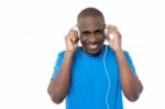 African Man Listen To Music With Headphones Stock Photo