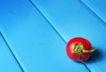 Fresh Tomatoes On The Blue Wooden Table Stock Photo