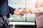 Closeup Friendly Meeting Handshake Between Business Woman And  B Stock Photo