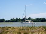 Yacht Cruising Down The River Alde Stock Photo