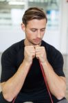 Happy Man Doing Stretching Exercises In A Health Club Stock Photo