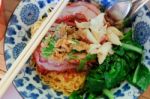 Egg Noodles With Roasted Red Pork With Crab Meat And Pak Choy. Famous Local Thai Stlye Street Food Stock Photo