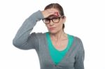 Expressionless Woman Looking At Distance Object Stock Photo