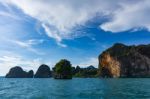 Island Cliffs In Turquois Sea And Blue Sky Stock Photo