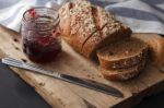 Dark Multigrain Bread Whole Grain And Jam Fresh Baked On Rustic Closeup Stock Photo