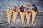 Concept For Homemade Various Nuts Ice Cream. Mixed Nuts In Waffl Stock Photo