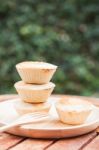 Mini Pies On Wooden Plate Stock Photo