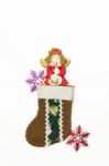 Red Angel In Brown Christmas Sock With Snowflake Stock Photo