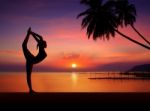 Silhouette Girl Doing Yoga Stock Photo