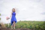 Beautiful Woman Wear Blue Evening Dress Hold A Bouquet Of Flower Stock Photo