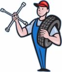 Mechanic With Tire Socket Wrench And Tire Stock Photo