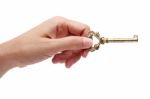 Hand Holding Golden Key Isolated On White Background Stock Photo