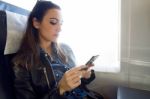 Beautiful Young Woman Using Her Mobile Phone In The Street Stock Photo