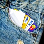 Jeans Lack And And Credit Card On The Wooden Floor Stock Photo