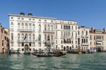 Gondolier Ferrying People In Venice Stock Photo