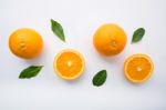 Fresh Orange Citrus Fruit On Wooden White Background. Top View Stock Photo