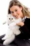 Female Smiling And Posing With Cat Stock Photo