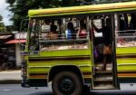 Fast Moving Bus Loaded Full With People Stock Photo