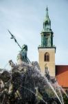 View Of The Neptune  Fountain With Marienkirche In The Backgroun Stock Photo