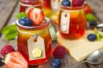 Red And Yellow Jelly Served With Fruit Stock Photo