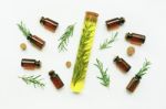 Glass Bottle Of Essential Oil  With Rosemary Stock Photo