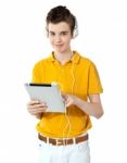 Boy Listening Music With Tablet Pc Stock Photo