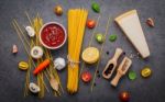 The Thin Spaghetti On Dark Stone Background. Yellow Italian Past Stock Photo