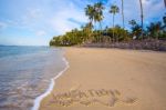 Inscription Of Vacation Written On Wet Yellow Beach Sand With Fo Stock Photo