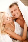 Couple Having Fun In Bed Stock Photo