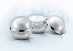 Silver Sphere Cosmetic Jar On Glitter Background Stock Photo