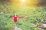 Summer Portrait Of Young  Women Enjoying Nature  In Tight Fitting Red Dress Summer Vacation,sunny,having Fun, Positive Mood,romantic, Against Background Of Summer Green Park, Green Leaves Stay Outdoor Stock Photo