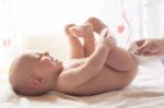 Mom Carefully Clean Baby Skin With Wet Wipes Stock Photo